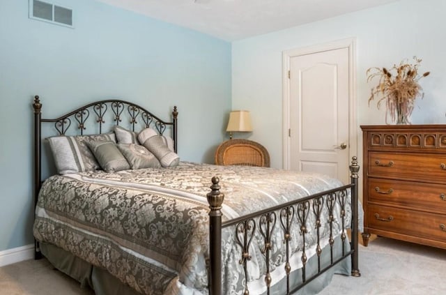 bedroom with light colored carpet