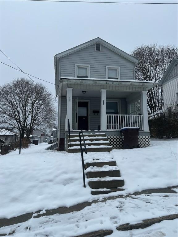 view of front of property featuring covered porch