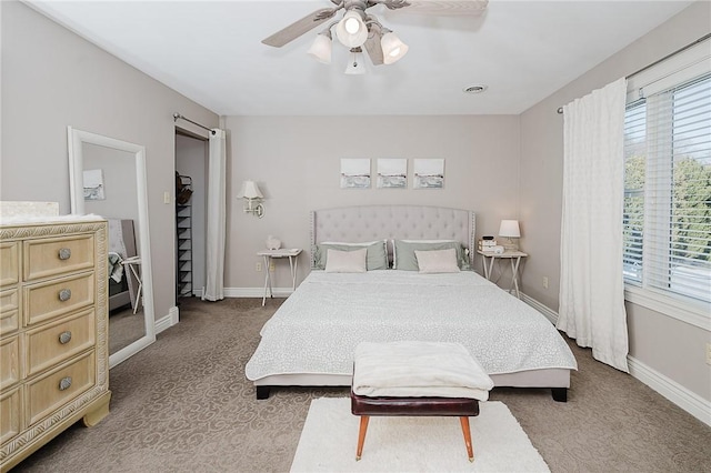 bedroom featuring multiple windows, carpet floors, and ceiling fan