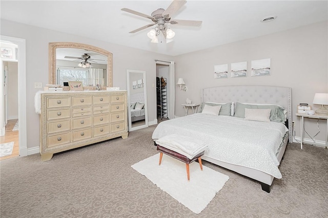 carpeted bedroom featuring ceiling fan