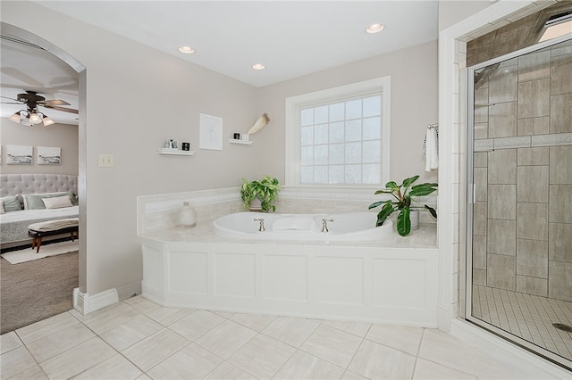 bathroom with tile patterned flooring, plus walk in shower, and ceiling fan