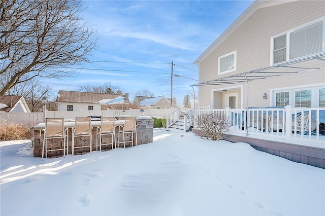 yard layered in snow featuring a bar