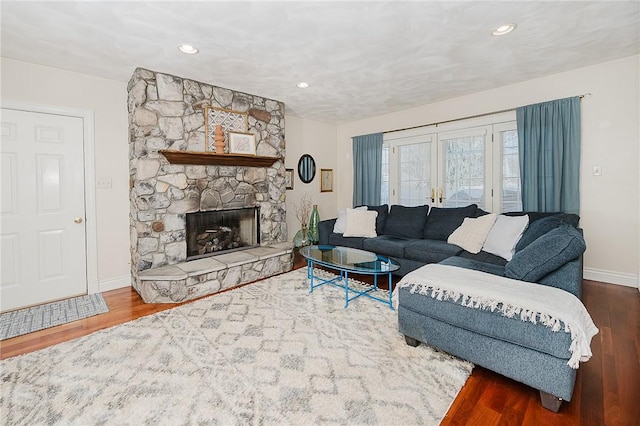 living room featuring hardwood / wood-style flooring and a fireplace