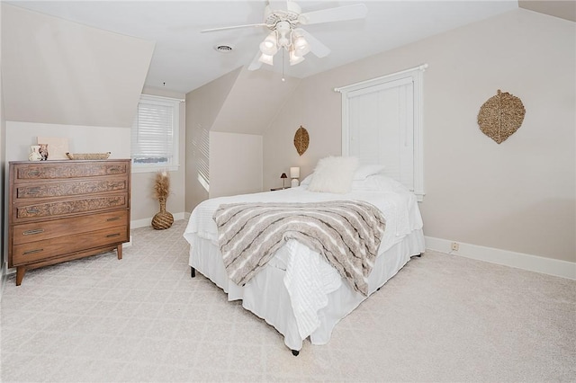 bedroom featuring ceiling fan, lofted ceiling, and light carpet