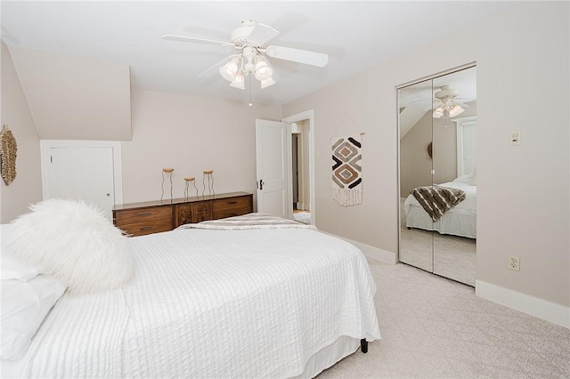 carpeted bedroom with a closet and ceiling fan