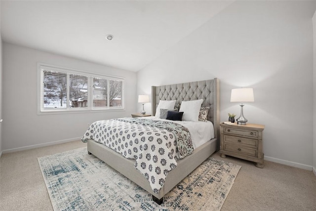 carpeted bedroom featuring vaulted ceiling