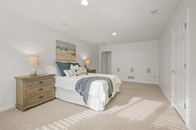 bedroom with light colored carpet