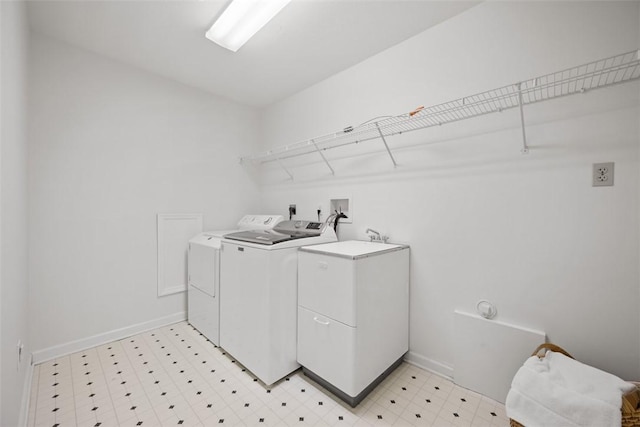 washroom with separate washer and dryer