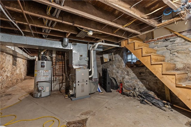 basement with gas water heater and heating unit