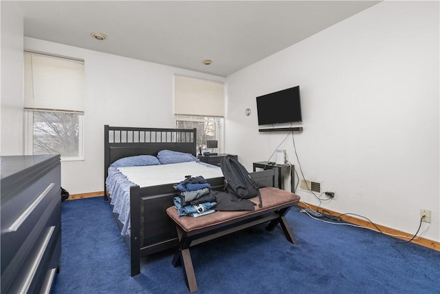 bedroom featuring dark colored carpet