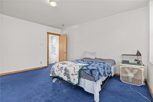 bedroom featuring dark colored carpet