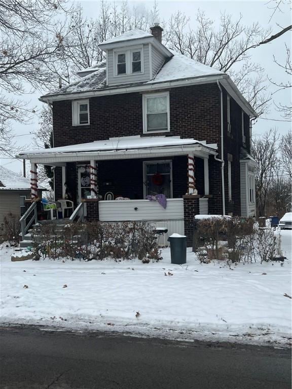 view of front of home featuring covered porch