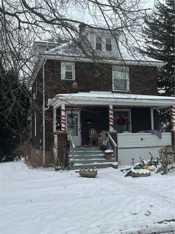 view of front of property featuring covered porch