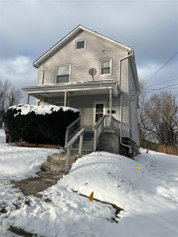 view of property featuring covered porch