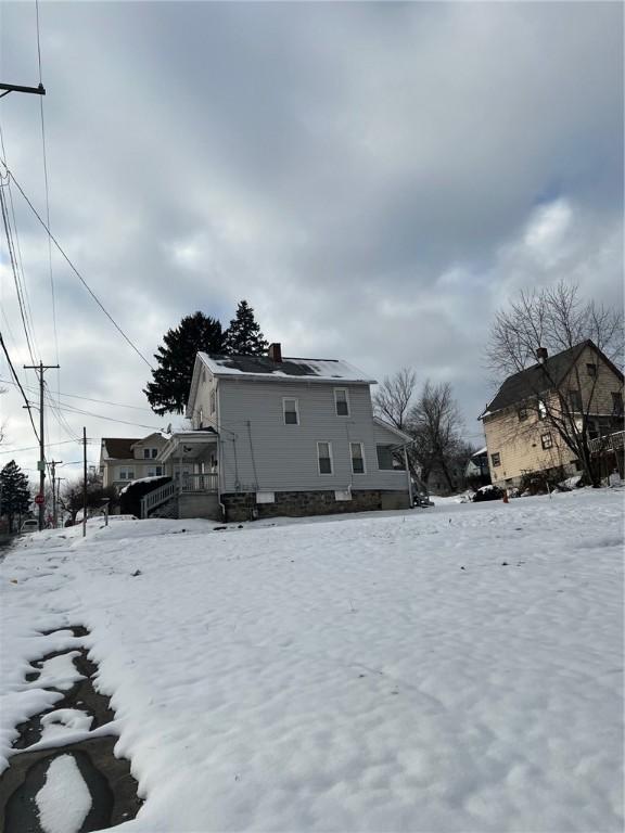 view of snow covered house