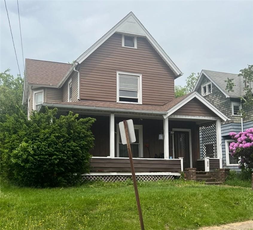 273 Orchard St, Sharon, PA 16146 - rear view of property with covered porch, a lawn, and roof with shingles