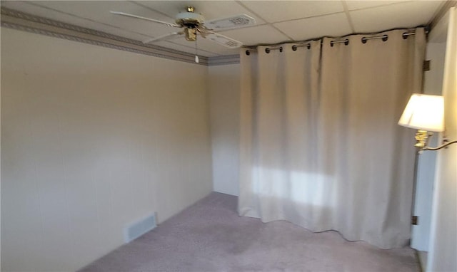 empty room with a paneled ceiling