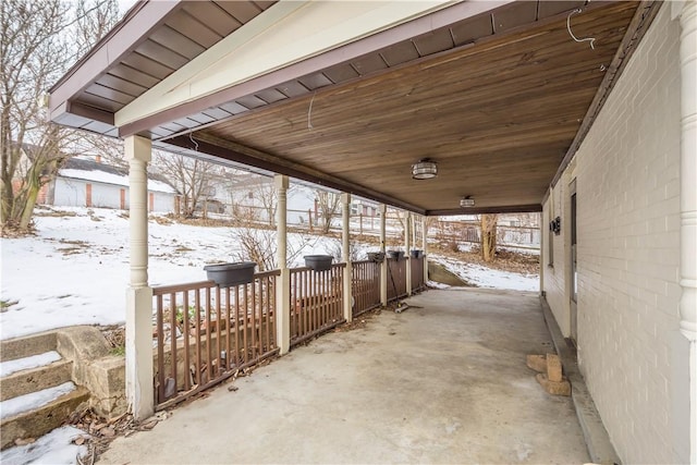 view of snow covered patio