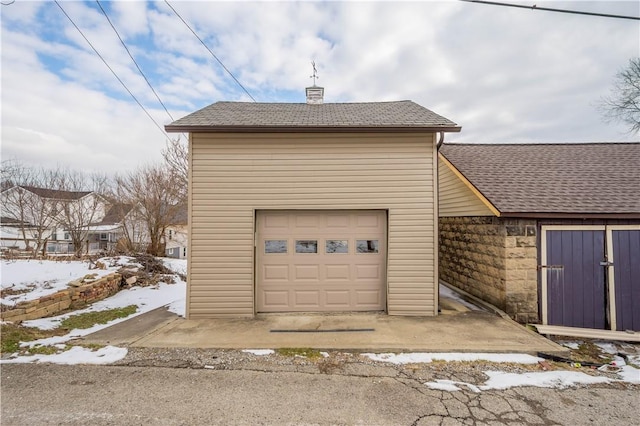 view of snow covered garage