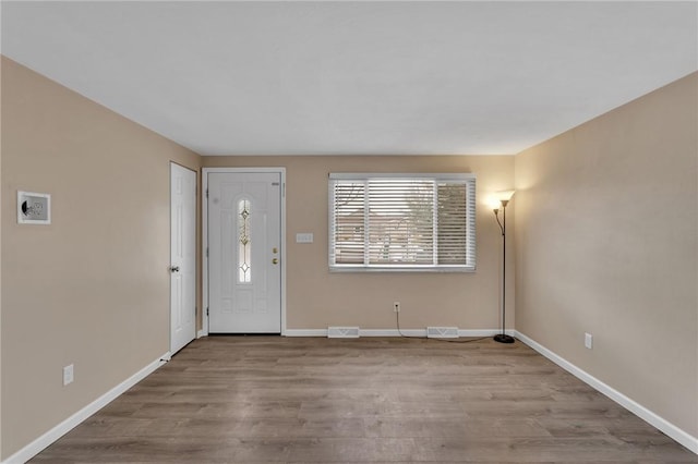 foyer entrance with light hardwood / wood-style flooring