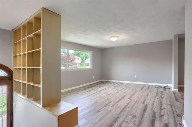 spare room with hardwood / wood-style floors