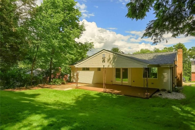 217 Belladonna Dr, Shaler, PA 15116 - back of property featuring a patio area, a lawn, a chimney, and a shingled roof