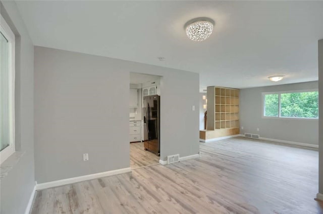 217 Belladonna Dr, Shaler, PA 15116 - unfurnished living room featuring light wood-type flooring and baseboards