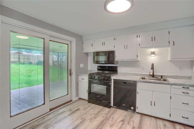217 Belladonna Dr, Shaler, PA 15116 - kitchen featuring black appliances, backsplash, white cabinets, and light wood-style floors