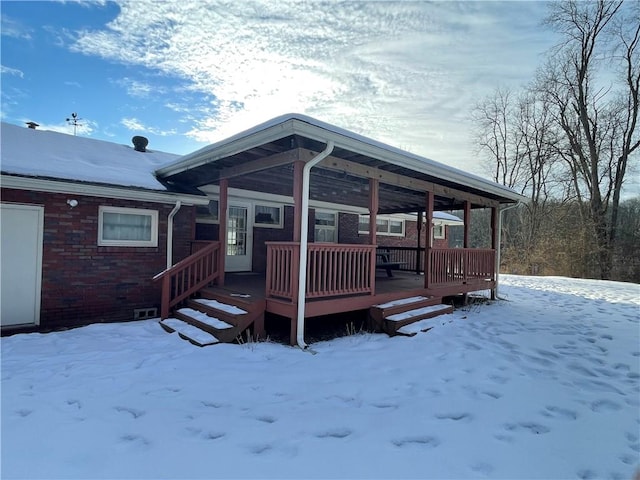 view of snow covered deck