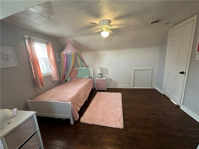 bedroom featuring ceiling fan and dark hardwood / wood-style flooring