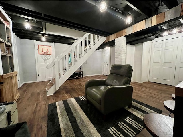 basement featuring dark hardwood / wood-style flooring