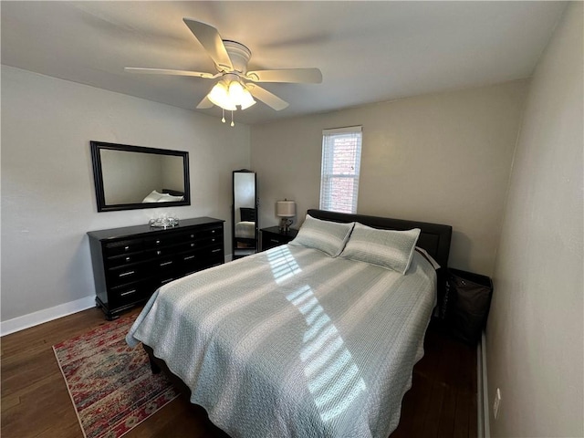 bedroom featuring ceiling fan and dark hardwood / wood-style floors