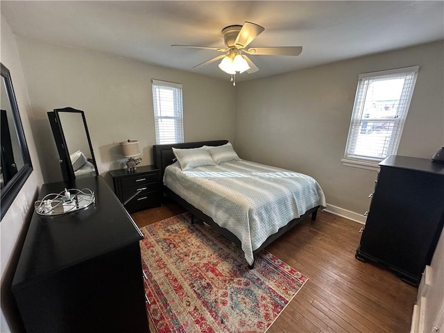 bedroom featuring dark hardwood / wood-style flooring and ceiling fan