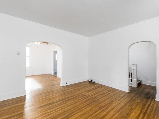 empty room featuring dark wood-type flooring