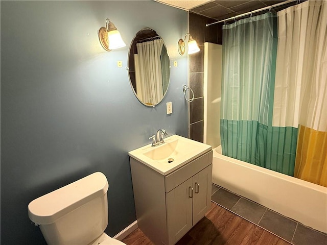 full bathroom featuring shower / tub combo, vanity, wood-type flooring, and toilet