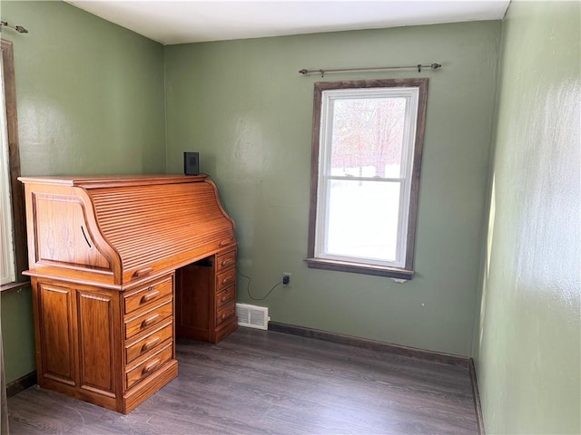 unfurnished office with dark hardwood / wood-style flooring