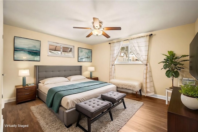 bedroom featuring hardwood / wood-style floors and ceiling fan