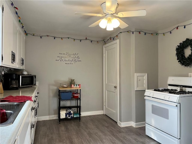 1410 Union Ave, Natrona Hts/Harrison Twp, PA 15065 - kitchen with white range with gas stovetop, stainless steel microwave, ceiling fan, and dark wood-style floors