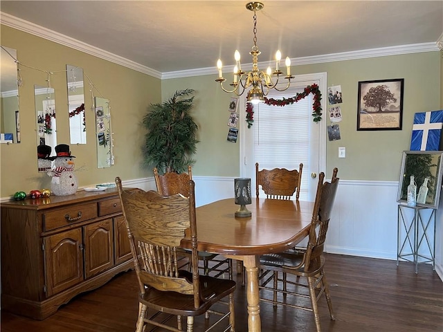 dining space featuring crown molding, dark hardwood / wood-style floors, and an inviting chandelier