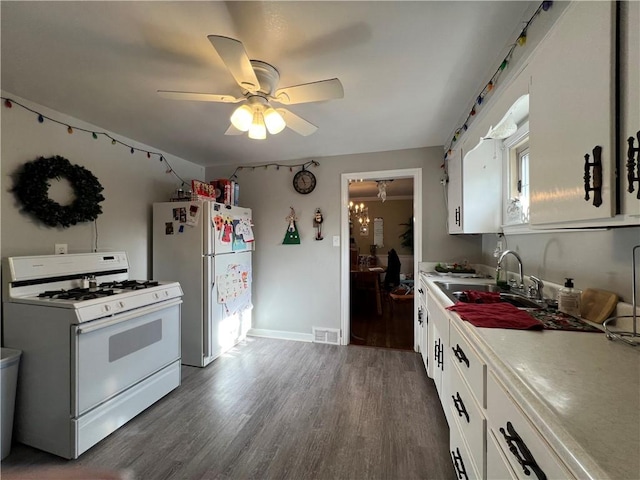 1410 Union Ave, Natrona Hts/Harrison Twp, PA 15065 - kitchen featuring white appliances, white cabinetry, dark wood-style floors, and a sink