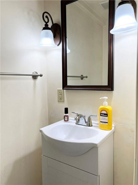 1410 Union Ave, Natrona Hts/Harrison Twp, PA 15065 - bathroom with vanity and ornamental molding