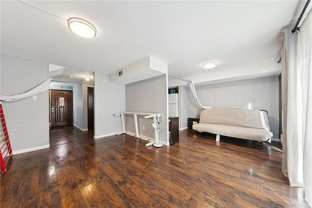 unfurnished room with dark hardwood / wood-style floors