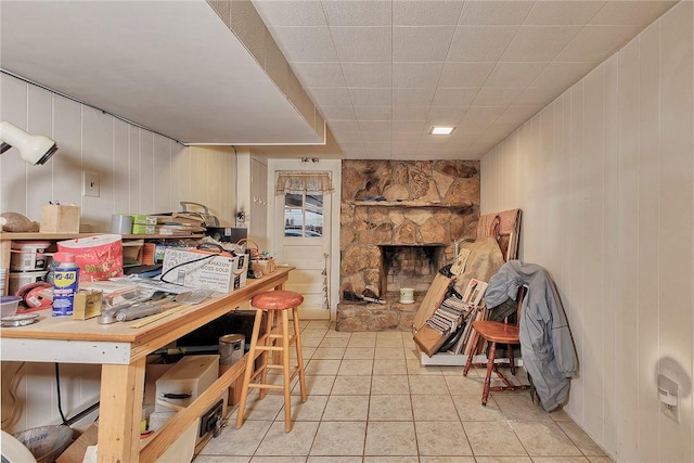 kitchen featuring a fireplace and light tile patterned floors