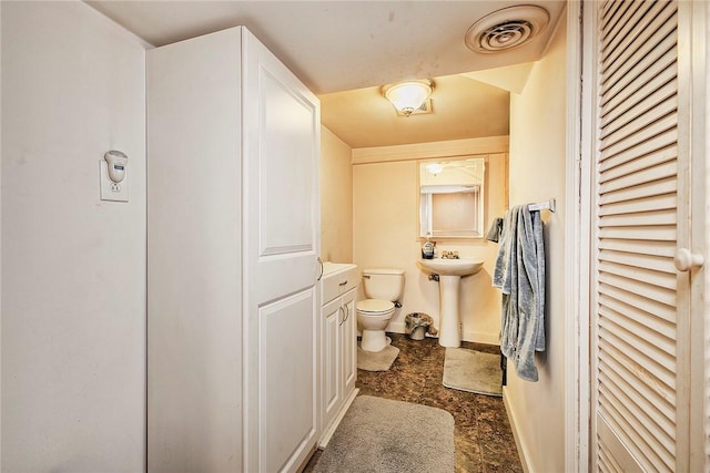 bathroom featuring toilet