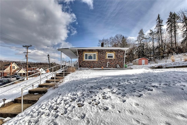 view of snow covered house