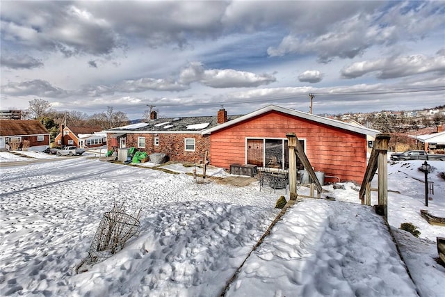 view of snow covered house