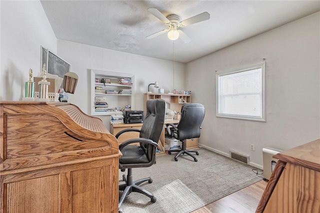 office with ceiling fan and light wood-type flooring