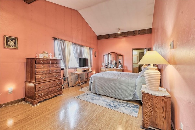 bedroom with hardwood / wood-style flooring and vaulted ceiling