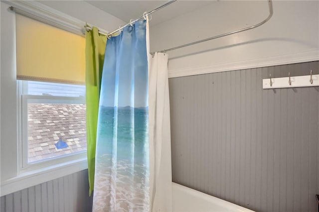 bathroom with shower / bathtub combination with curtain