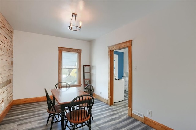 dining space featuring wood-type flooring